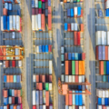 Overhead view of a shipping yard and colorful shipping containers.